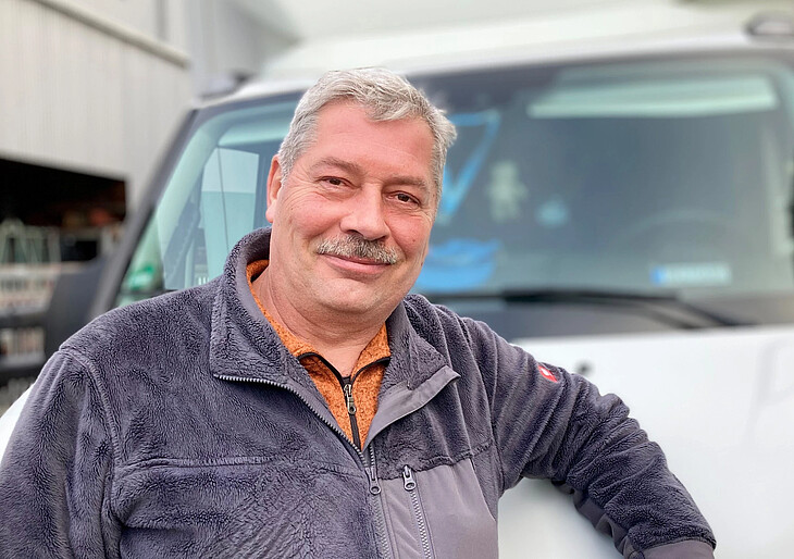 DMG employee Wolfgang Mülelr in front of his DMG lorry