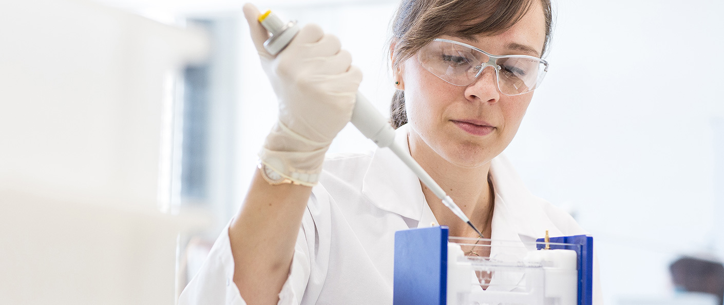 Lab employee with pipette